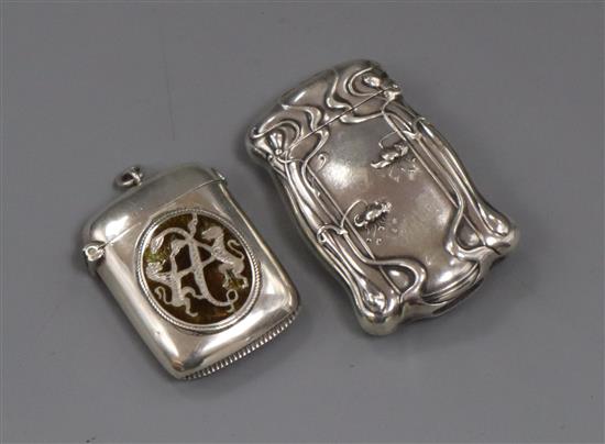 A late Victorian silver and enamel vesta case and an American Art Nouveau sterling vesta case, largest 6cm.